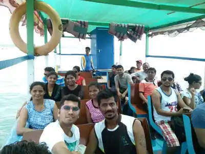 Tour Group inside motor boat on Malvan scuba tour