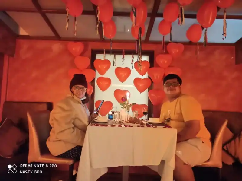 Romantic dinner setting honeymoon couple