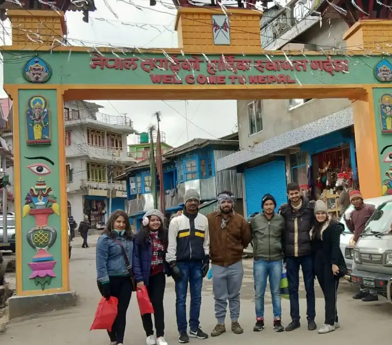 Tour Group posing with mountains Nepal