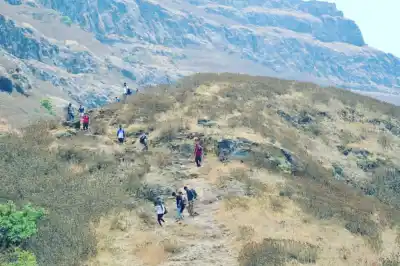 Tour Group hiking along scenic mountain ridge on Rajgad to Torana Trek